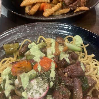 OMELI Kitchen - Rib Eye Garlic Noodles Lomo Saltado - Vietnamese Near Me - Fullerton, California OMELI Kitchen - Rib Eye Garlic Noodles Lomo Saltado - Vietnamese Near Me - Fullerton, California