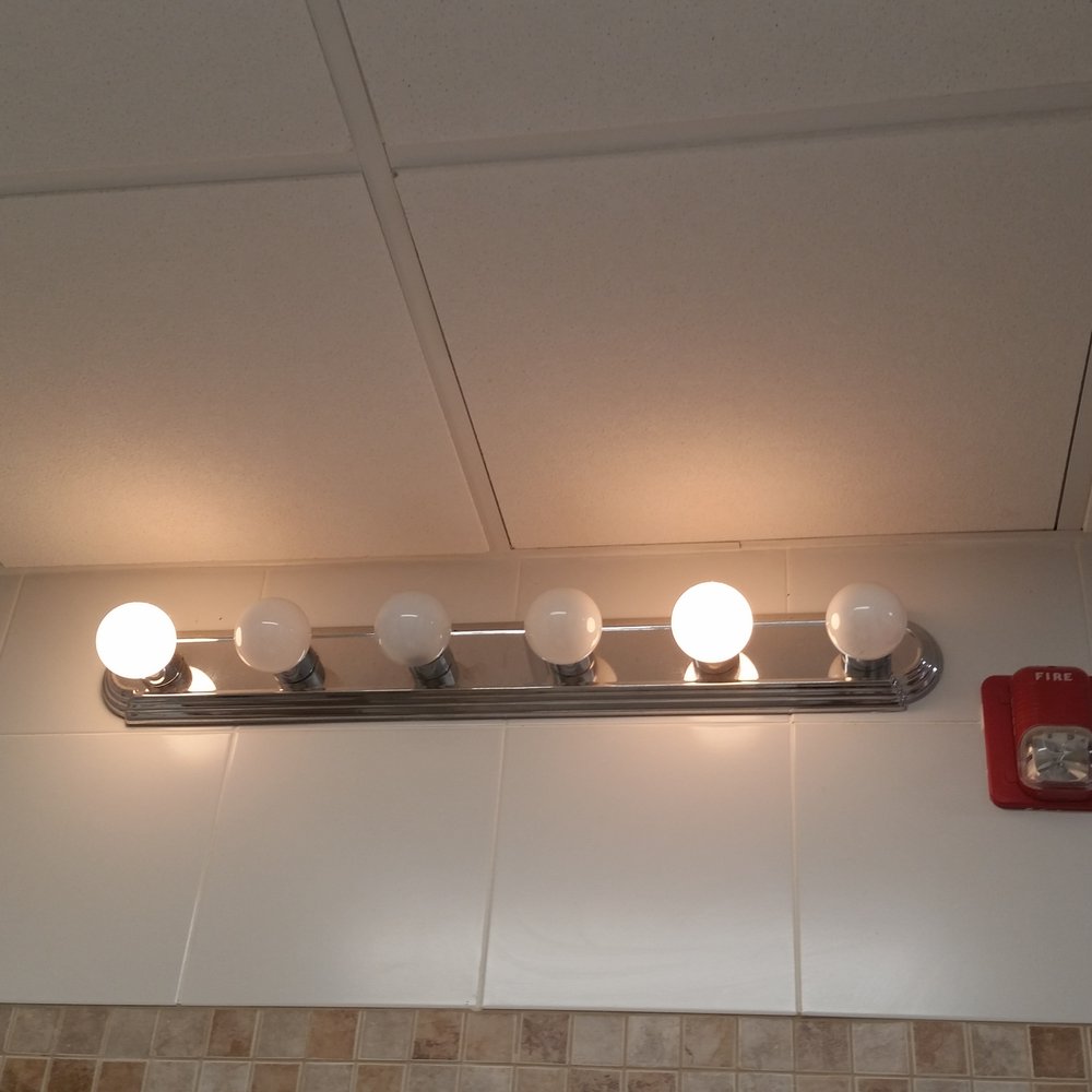 Fun World - Looks like a fairly newly remodeled bathroom but many bulbs out - Amusement Parks Near Me - Nashua, New Hampshire