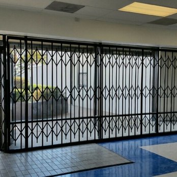 Custom Security Doors - top and bottom track all steel folding gate - Windows Installation Near Me - Dallas, Texas Custom Security Doors - top and bottom track all steel folding gate - Windows Installation Near Me - Dallas, Texas
