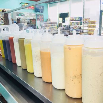 Quick food deli - a row of condiments on a conveyor belt - Sandwiches Near Me - Hazlet, New Jersey Quick food deli - a row of condiments on a conveyor belt - Sandwiches Near Me - Hazlet, New Jersey