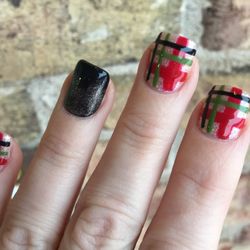 Holiday theme with black and gold accent nail Gel polish