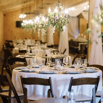 Castleton Farms Event Facility - Hanging floral centerpieces are perfect in The Carriage House! - Venues & Event Spaces Near Me - Loudon, Tennessee