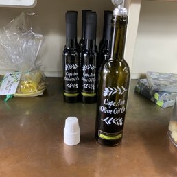 bottles of olive oil on a counter bottles of olive oil on a counter