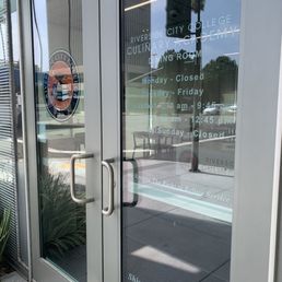 Exterior outside entrance of Riverside Community College Culinary Academy - Hours on the front door - Riverside, California Exterior outside entrance of Riverside Community College Culinary Academy - Hours on the front door - Riverside, California