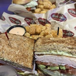 CALIFORNIA TURKEY sandwich with SIDE TATER TOTS: 5/5 super yummy!! In the background is a burger, but can't remember which one he ordered CALIFORNIA TURKEY sandwich with SIDE TATER TOTS: 5/5 super yummy!! In the background is a burger, but can't remember which one he ordered
