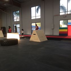 Rogue Parkour Gym - The coaches doing laps with my daughter during the Youth 1 class.