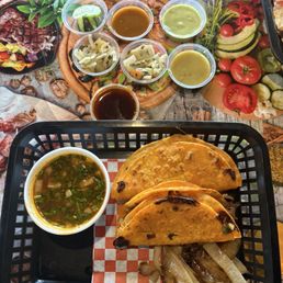 #4- 2 quesabirria tacos with consommé and salsa and pickled vegs from the salsa bar #4- 2 quesabirria tacos with consommé and salsa and pickled vegs from the salsa bar