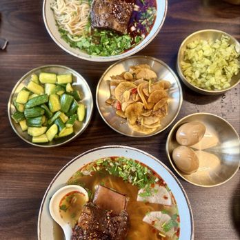 Shake Shake Fresh Noodle - The spread! Bone in beef spicy noodle soup, cucumbers, daikons, eggs, cabbage. - Noodles Near Me - San Luis Obispo, California