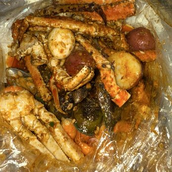 The Crab Pad - King Crab Shrimp Special plus mussels, snow crab and an egg! - Seafood Near Me - Chicago, Illinois The Crab Pad - King Crab Shrimp Special plus mussels, snow crab and an egg! - Seafood Near Me - Chicago, Illinois
