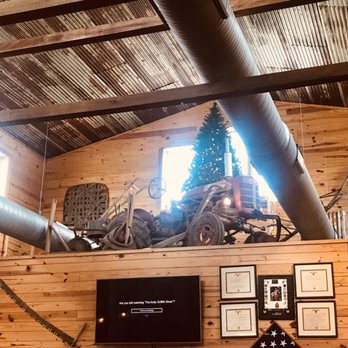 Rouse’s Restaurant - Old antique tractor and other antiques over buffet tables - American Near Me - Snow Hill, North Carolina