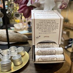 Upper Village Blooms - Silken Lips, Lip Balm on the counter.