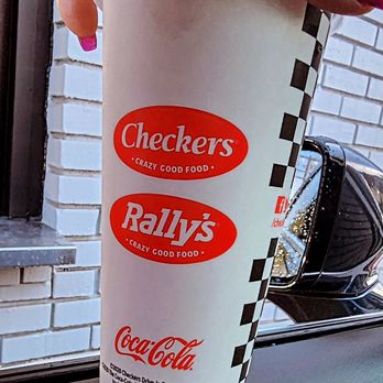 Rally's - a hand holding a cup of coffee - Burgers Near Me - Pomona, California