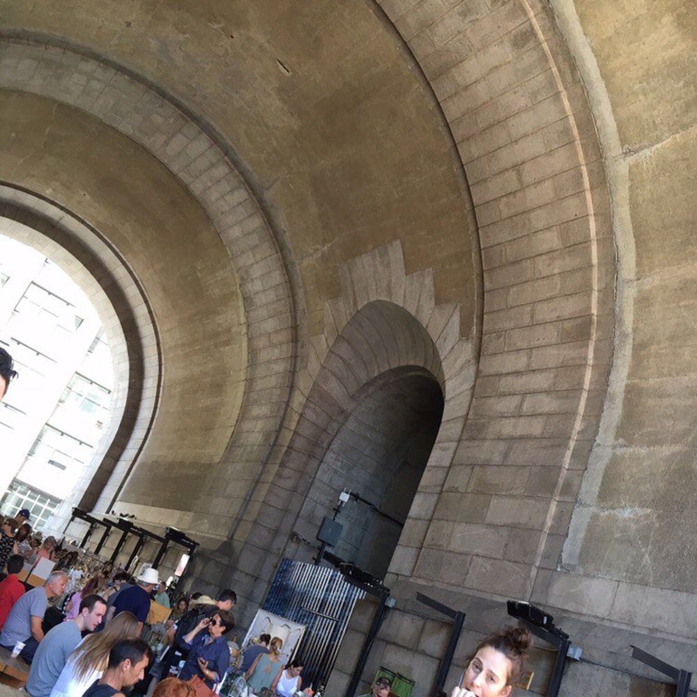 Brooklyn Flea - Our beautiful view as we sat under the archway to eat. - Flea Markets Near Me - Brooklyn, New York