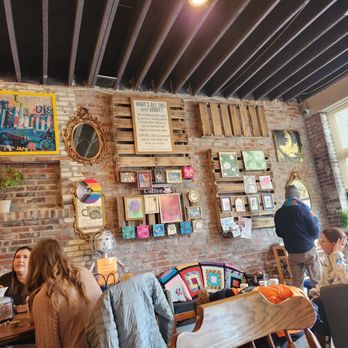 Espresso Yourself Coffee & Cafe - One of the walls decorated with cute art! - Coffee & Tea Near Me - St. Louis, Missouri Espresso Yourself Coffee & Cafe - One of the walls decorated with cute art! - Coffee & Tea Near Me - St. Louis, Missouri