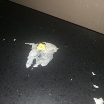 AMC Mesquite 30 - Chewed gum on the table top arm rest. - Cinema Near Me - Mesquite, Texas