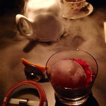 The Aviary - Ford's Model Tea Party on top (sweeter drink), In The Rocks (the one you break open w/ a "sling shot") on the bottom. So tasty! - Cocktail Bars Near Me - Chicago, Illinois The Aviary - Ford's Model Tea Party on top (sweeter drink), In The Rocks (the one you break open w/ a "sling shot") on the bottom. So tasty! - Cocktail Bars Near Me - Chicago, Illinois