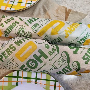Subway - a sandwich wrapped in paper on a table - Sandwiches Near Me - Arlington Heights, Illinois Subway - a sandwich wrapped in paper on a table - Sandwiches Near Me - Arlington Heights, Illinois