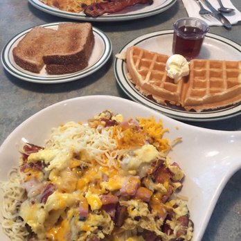 Country Waffles - Porky Pig Skillet with a side of Half Pancake (front), Breakfast Platter of 3 Eggs, Bacon, Hash Brown, and Toasts (rear) - Breakfast & Brunch Near Me - Dublin, California Country Waffles - Porky Pig Skillet with a side of Half Pancake (front), Breakfast Platter of 3 Eggs, Bacon, Hash Brown, and Toasts (rear) - Breakfast & Brunch Near Me - Dublin, California