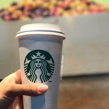 Starbucks - a hand holding a cup of coffee - Coffee & Tea Near Me - Ottawa, Ontario