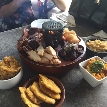 Asador San Miguel - For four people, excellent with modongo, tostones, majado batata and arroz mamposteao - Latin American Near Me - Cedro Arriba, Puerto Rico Asador San Miguel - For four people, excellent with modongo, tostones, majado batata and arroz mamposteao - Latin American Near Me - Cedro Arriba, Puerto Rico