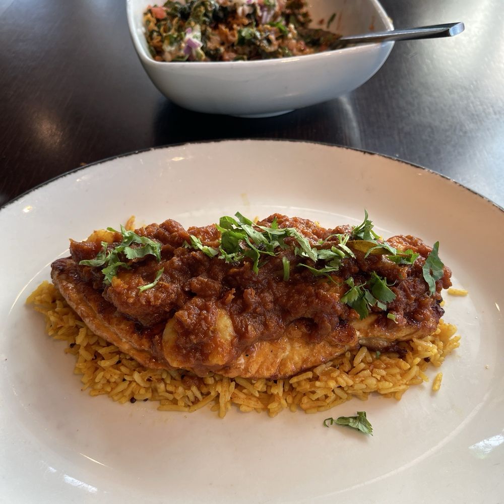 Rasika West End - Palak chaat (in the back), snapper rechad on a bed of rice with shrimp - Indian Near Me - Washington, DC, District of Columbia Rasika West End - Palak chaat (in the back), snapper rechad on a bed of rice with shrimp - Indian Near Me - Washington, DC, District of Columbia
