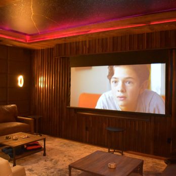 SB Comm - Media Room with 85" TV and custom cinema scope drop down screen for a true media experience. - Home Theatre Installation Near Me - Snellville, Georgia SB Comm - Media Room with 85" TV and custom cinema scope drop down screen for a true media experience. - Home Theatre Installation Near Me - Snellville, Georgia