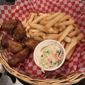 The Grand Experience - a basket of food with fries and coleslaw - Pubs Near Me - Lindsay, Ontario