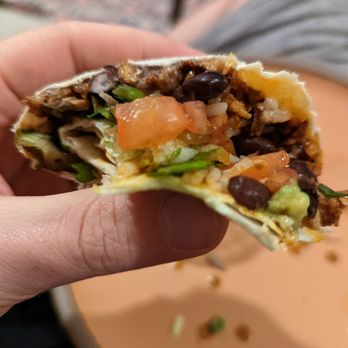 Fatty Daddy Taco - a hand holding a burrito - Mexican Near Me - Brooklyn, New York Fatty Daddy Taco - a hand holding a burrito - Mexican Near Me - Brooklyn, New York