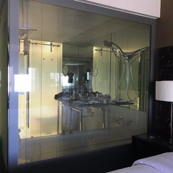Sheraton Lisboa Hotel & Spa - There is blind, between the class, which can go up or down and shut or open by a switch. - Hotels Near Me - Lisbon, 11