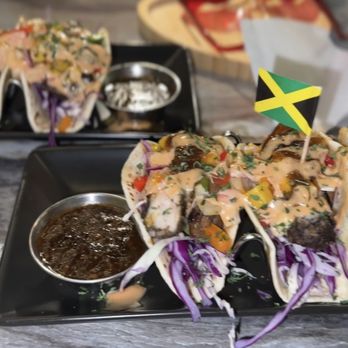Mobay Spice - Right: Jerk Chicken Taco Left: Oxtail tacos - Caribbean Near Me - Atlanta, Georgia Mobay Spice - Right: Jerk Chicken Taco Left: Oxtail tacos - Caribbean Near Me - Atlanta, Georgia