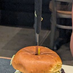 Lettuce on handle of knife.