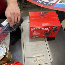 Lowe's Home Improvement - Orbital sander, and the sign