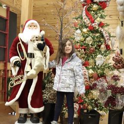 Holly Jolly Christmas Shop - An adorable Santa statue