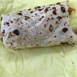 Half of my breakfast burrito I appreciate the charing on the tortilla makes for fond memories of my childhood lol