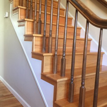 Masterpiece Floors - a staircase with wooden handrails - Flooring Near Me - Westminster, Colorado Masterpiece Floors - a staircase with wooden handrails - Flooring Near Me - Westminster, Colorado