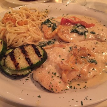 Capriccio Italian Restaurant - Pollo Genovese with cream sauce on bed of spinach, spaghetti and grilled zucchini - Italian Near Me - Rogers, Arkansas Capriccio Italian Restaurant - Pollo Genovese with cream sauce on bed of spinach, spaghetti and grilled zucchini - Italian Near Me - Rogers, Arkansas