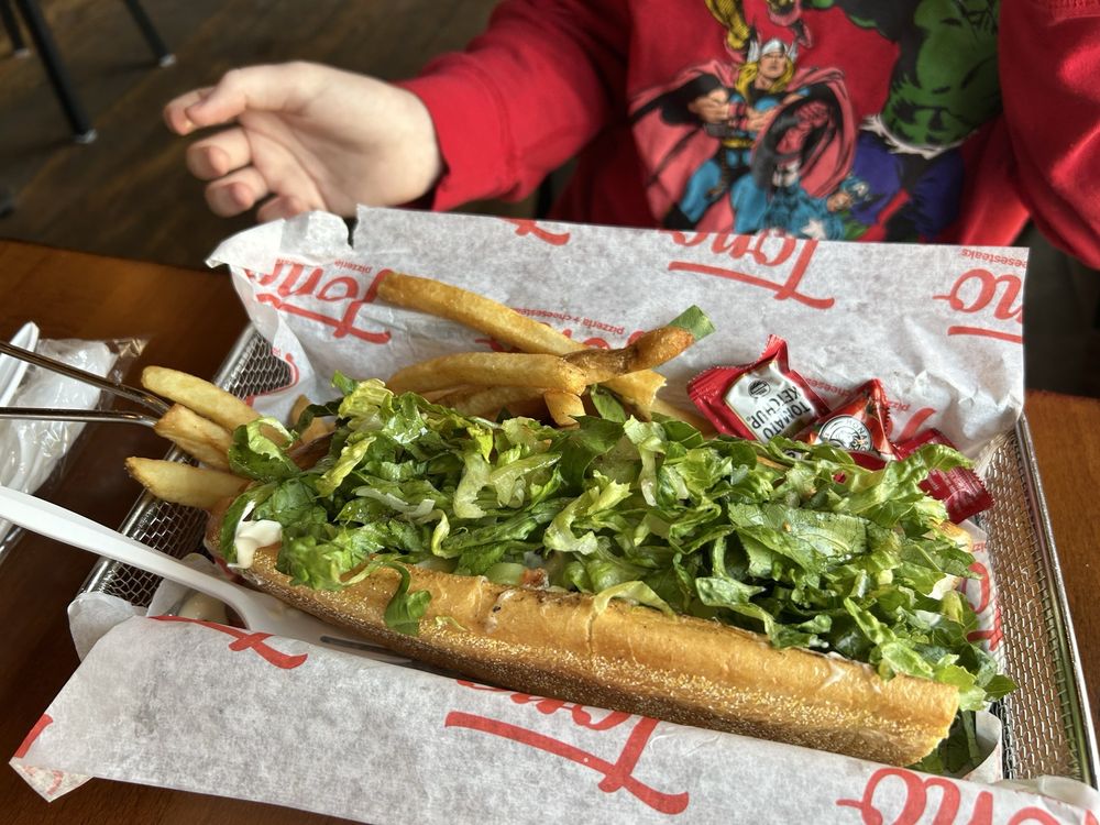 Tono Pizzeria + Cheesesteaks Logo