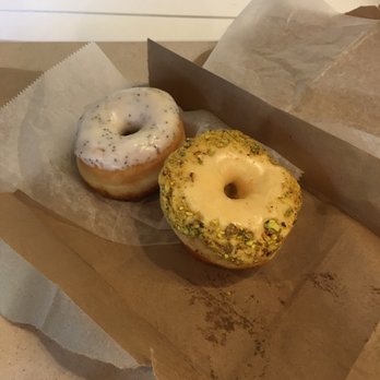 Revolution Doughnuts - Lemon poppyseed and orange pistachio (left to right) - Donuts Near Me - Atlanta, Georgia Revolution Doughnuts - Lemon poppyseed and orange pistachio (left to right) - Donuts Near Me - Atlanta, Georgia