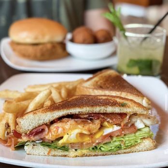 Pub W - a sandwich and chips on a plate - American Near Me - Oklahoma City, Oklahoma Pub W - a sandwich and chips on a plate - American Near Me - Oklahoma City, Oklahoma