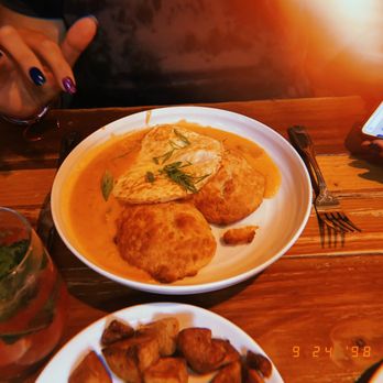 Depot Street Tavern - a person taking a picture of a plate of food - Bars Near Me - Milford, Massachusetts
