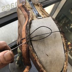 Maselli Bros. Shoe & Luggage Repair - re-welting Dan Post cowboy boots 270 degrees around while removing old stitches with diagonals before each jerk ... by Matt ....