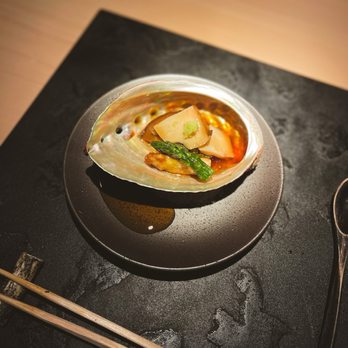 Nama - a bowl of soup on a plate with chopsticks - Japanese Near Me - New York, New York Nama - a bowl of soup on a plate with chopsticks - Japanese Near Me - New York, New York