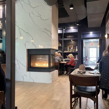 White Rhino Coffee - a fireplace in the middle of the room - Coffee & Tea Near Me - Frisco, Texas White Rhino Coffee - a fireplace in the middle of the room - Coffee & Tea Near Me - Frisco, Texas