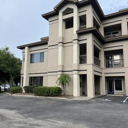 Rae Laws - Farrell International Realty - Exterior of building offering plenty of parking