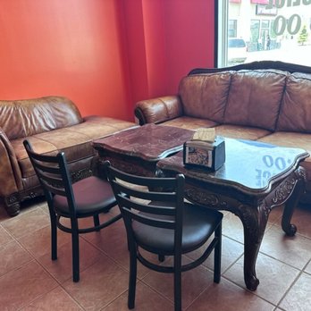 Pizza Box - a couch, table, and chairs in a restaurant - Bubble Tea Near Me - Beaumont, Alberta