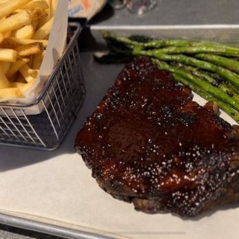 Dave & Buster's Springfield - 1/2 rack of spare ribs, fries, and asparagus. - American Near Me - Springfield, Virginia Dave & Buster's Springfield - 1/2 rack of spare ribs, fries, and asparagus. - American Near Me - Springfield, Virginia
