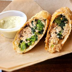 The Stables Kitchen & Beer Garden - Pulled pork egg rolls with sharp provolone and broccoli rabe. Excellent