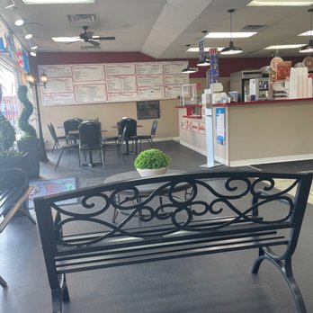 Italian Village - a bench in a restaurant - Italian Near Me - Richlands, Virginia Italian Village - a bench in a restaurant - Italian Near Me - Richlands, Virginia