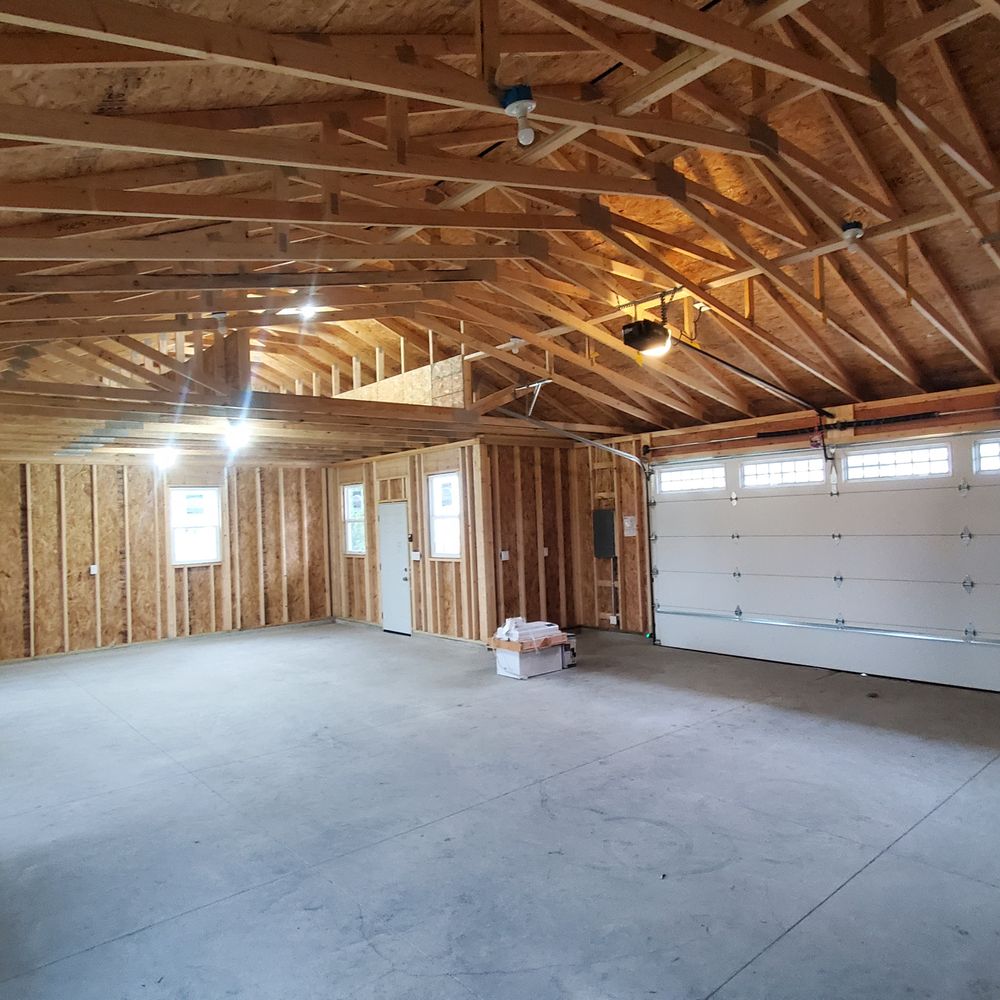 Deck It Out Builders - Vaulted ceiling over vehicle area for lift and storage area over room. - General Contractors Near Me - Racine, Wisconsin Deck It Out Builders - Vaulted ceiling over vehicle area for lift and storage area over room. - General Contractors Near Me - Racine, Wisconsin