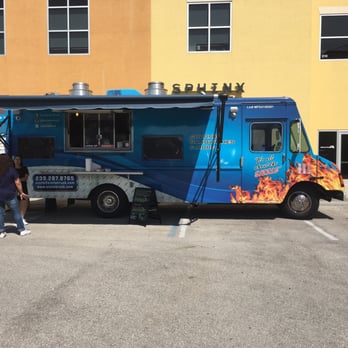 The Sizzle Truck - a man standing in front of it - Food Trucks Near Me The Sizzle Truck - a man standing in front of it - Food Trucks Near Me